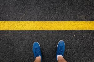 person in blue and white sneakers